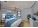 Bedroom featuring laminate flooring, a ceiling fan, and a large window at 9210 Lehall W Sq, Lakeland, FL 33810