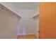 Walk-in closet with two hanging rods and laminate flooring at 9210 Lehall W Sq, Lakeland, FL 33810