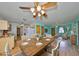 Open-concept dining room adjacent to kitchen and living area at 9210 Lehall W Sq, Lakeland, FL 33810