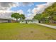Charming home with well-maintained front yard and long driveway at 9210 Lehall W Sq, Lakeland, FL 33810