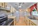 Galley kitchen featuring light wood cabinets, stainless steel appliances, and lots of natural light at 9210 Lehall W Sq, Lakeland, FL 33810