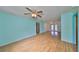 The expansive living space boasts laminate flooring and seamless transitions to other areas at 9210 Lehall W Sq, Lakeland, FL 33810