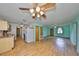 Spacious open-concept design with laminate flooring that seamlessly connects the living spaces at 9210 Lehall W Sq, Lakeland, FL 33810