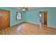 Inviting living room with wood-look floors, and natural light at 9210 Lehall W Sq, Lakeland, FL 33810