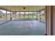 Enclosed sunroom with lots of windows for natural light and views of the backyard at 9210 Lehall W Sq, Lakeland, FL 33810