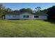 Expansive backyard with lush green lawn, perfect for outdoor activities at 990 Keen Rd, Frostproof, FL 33843