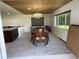 Bright dining area with wood ceiling, chandelier, and elegant dining set at 990 Keen Rd, Frostproof, FL 33843