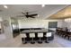 Modern kitchen with granite island, stainless appliances, and pendant lighting at 990 Keen Rd, Frostproof, FL 33843