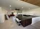 Open-concept kitchen with island seating, seamlessly flowing into the living area at 990 Keen Rd, Frostproof, FL 33843