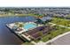 Aerial view of a community pool, playground, and clubhouse near a lake with neighborhood at 748 Terrapin Dr, Debary, FL 32713