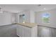 Kitchen island with granite countertop, with view to the lake at 2214 Pecos Ct, Poinciana, FL 34759