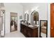 Bright bathroom features dual sinks, granite counters, and a walk-in shower at 4014 Gallagher Loop, Casselberry, FL 32707