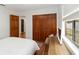 Comfortable bedroom featuring wood floors and a spacious closet at 4014 Gallagher Loop, Casselberry, FL 32707