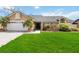 Charming one-story home with a manicured lawn, beautiful landscaping, and an attached two-car garage at 4014 Gallagher Loop, Casselberry, FL 32707