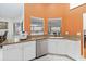 Bright kitchen with granite counters, stainless appliances, and white cabinets at 4014 Gallagher Loop, Casselberry, FL 32707