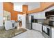 Spacious kitchen with stainless appliances, granite counters, and white cabinetry at 4014 Gallagher Loop, Casselberry, FL 32707