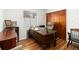 Home office featuring an ornate desk and wood laminate flooring at 4014 Gallagher Loop, Casselberry, FL 32707