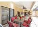 Inviting covered patio with ceiling fans and comfortable seating area at 4014 Gallagher Loop, Casselberry, FL 32707