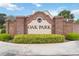 Community sign for Oak Park with brick facade and manicured landscaping at 4014 Gallagher Loop, Casselberry, FL 32707