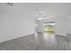 Bright and spacious living room with sliding glass doors offering a view of the lake at 58 Herring Ct, Poinciana, FL 34759