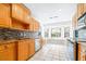 Updated kitchen featuring stainless steel appliances, granite countertops, and a bright breakfast nook at 7220 Pinehaven Dr, Lakeland, FL 33810