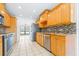 Updated kitchen featuring stainless steel appliances, granite countertops, and tile backsplash at 7220 Pinehaven Dr, Lakeland, FL 33810