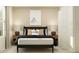 Neutral bedroom featuring modern decor, roller skate art, and matching nightstands at 1321 Acorn Meadow Loop, Eustis, FL 32726