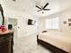 Comfortable bedroom with marble floors, a TV, and a view of other rooms, offering a modern living experience at 2735 Berkford Cir, Lakeland, FL 33810
