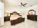 Serene bedroom featuring a decorative bed frame, marble floors, and ample space for relaxation and comfort at 2735 Berkford Cir, Lakeland, FL 33810
