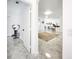Hallway view leading to a kitchen with a bar, offering a glimpse of an open and inviting living space at 2735 Berkford Cir, Lakeland, FL 33810