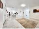 Bright, open living space with marble floors, leading to a kitchen and bar area, perfect for entertaining at 2735 Berkford Cir, Lakeland, FL 33810