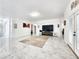 Expansive living room with sleek marble floors, a large TV, and neutral decor for a modern, airy feel at 2735 Berkford Cir, Lakeland, FL 33810