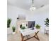 Bright office featuring a modern desk, elegant chandelier, and decorative fireplace with lush greenery accents at 2735 Berkford Cir, Lakeland, FL 33810