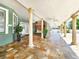 Relaxing porch with stone floors and ornamental columns at 2735 Berkford Cir, Lakeland, FL 33810