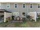 Backyard with patio featuring seating and grilling area on a lush lawn at 350 N 1St Ave, Bartow, FL 33830