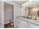 Bathroom with granite countertops, wood-look floors, and glass shower stall at 350 N 1St Ave, Bartow, FL 33830