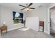 Bedroom featuring neutral walls, gray carpet, and a window with curtains at 350 N 1St Ave, Bartow, FL 33830