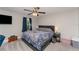 Cozy bedroom with a comfortable bed, soft carpet, and natural light at 350 N 1St Ave, Bartow, FL 33830