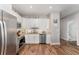 Well-lit kitchen featuring stainless steel appliances and granite countertops at 350 N 1St Ave, Bartow, FL 33830