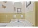 Bathroom with vanity sink and light green tile with shower to the right at 4915 Whiteoak E Dr, Lakeland, FL 33813