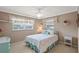 Inviting bedroom with ample natural light, ceiling fan, and decorative accents at 4915 Whiteoak E Dr, Lakeland, FL 33813