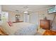 Well-lit bedroom features a ceiling fan and neutral walls, creating a calm and inviting space at 4915 Whiteoak E Dr, Lakeland, FL 33813