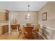 Formal dining room featuring wood table, chair set, and decorative lighting fixture at 4915 Whiteoak E Dr, Lakeland, FL 33813
