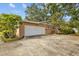 Garage features a large driveway and door at 4915 Whiteoak E Dr, Lakeland, FL 33813