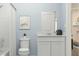 Cozy bathroom featuring modern fixtures, blue walls, and a sleek vanity at 2627 Skyline Loop, Kissimmee, FL 34758