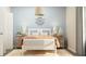 Cozy bedroom showcasing nautical-themed décor, soft lighting, and comfortable furnishings at 2627 Skyline Loop, Kissimmee, FL 34758