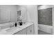 Modern bathroom with double sinks, quartz countertop, decorative tile backsplash, and tub at 611 Terrapin Dr, Debary, FL 32713