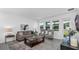 Cozy living room with comfortable seating, stylish decor, and ample natural light at 611 Terrapin Dr, Debary, FL 32713