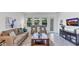 Inviting living room featuring a large sofa, accent chairs, and view of the backyard at 611 Terrapin Dr, Debary, FL 32713