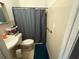 Cozy bathroom with essential fixtures, including a toilet, sink, and shower with curtain at 612 Acapulca Way, Altamonte Springs, FL 32714